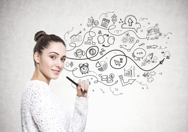 Beautiful young woman with a marker, strategy